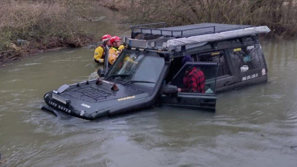 Land Rover stuck in water