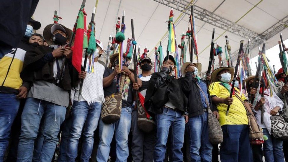 Indigenous protesters raise their batons during a symbolic "impeachment" of President Iván Duque in Bogotá. Photo: 19 October 2020