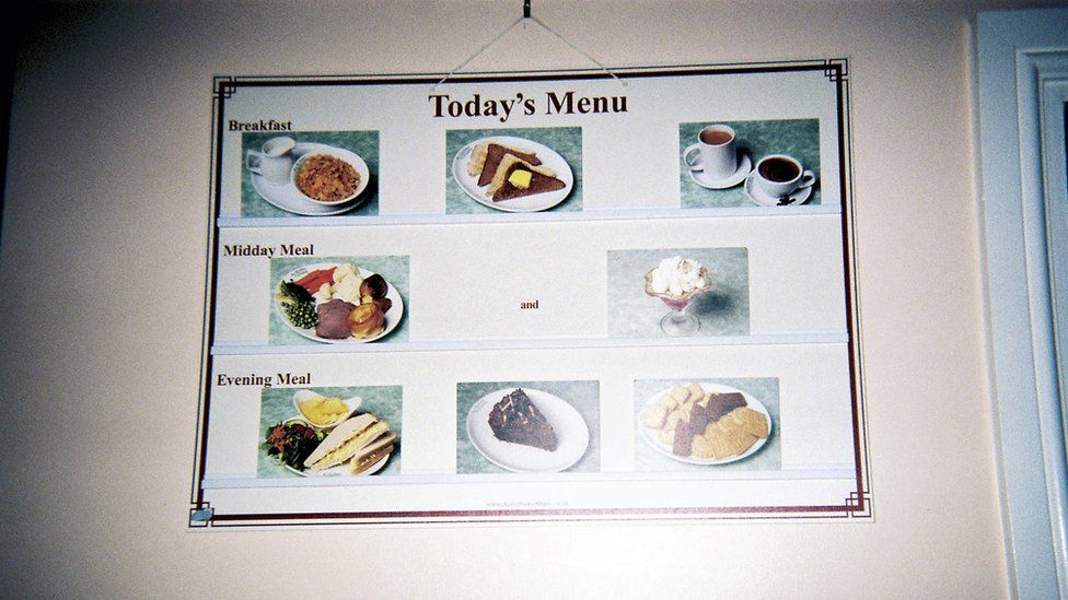 A wall planner showing the care home meal menu