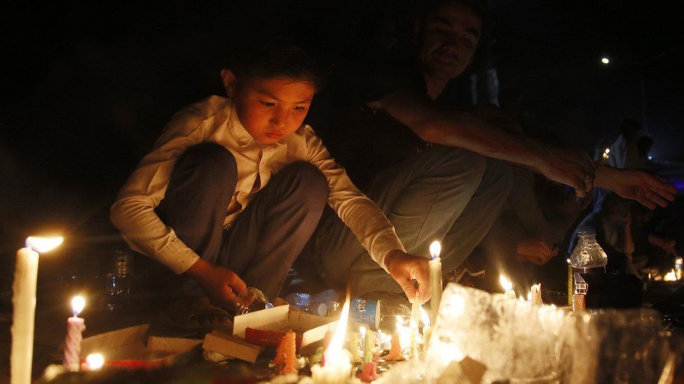 Candles lit during memorial for victims of suicide bomb blast in Kabul. 23 July 2016