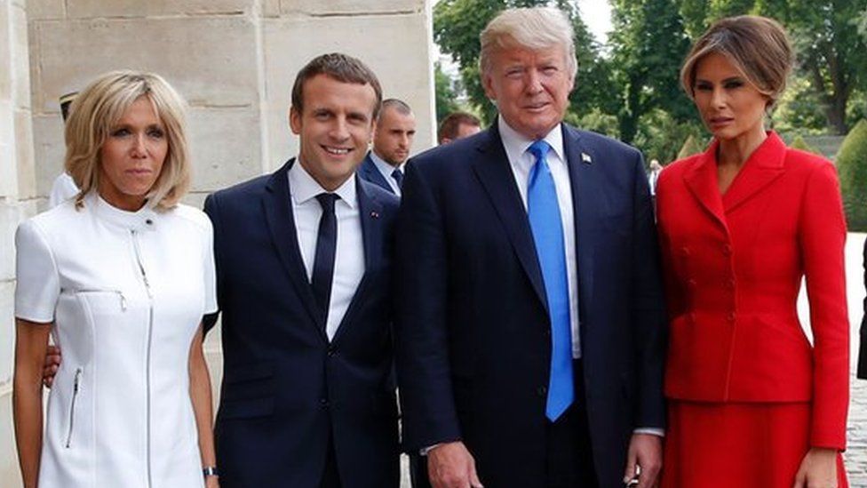 French President Emmanuel Macron (2L) poses next to his wife Brigitte Macron (L), US President Donald Trump and US First Lady Melania Trump outside the Army Museum