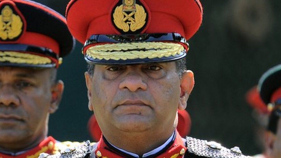 Sri Lanka's outgoing army chief Jagath Jayasuriya (C) and his successor, Major General Daya Ratnayake (L) arrive at a farewell ceremony in the capital Colombo on July 30, 2013.