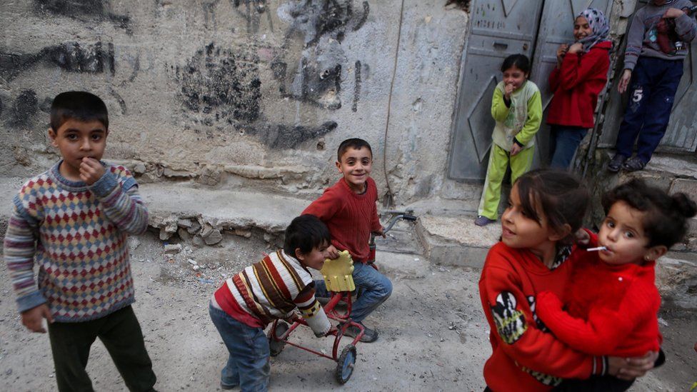 Children play in the rebel-held Tishreen district of Damascus, 27 February