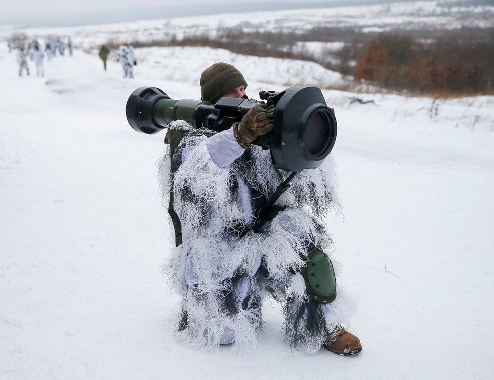 A Ukrainian service member holds a next generation light anti-tank weapon near Yavoriv