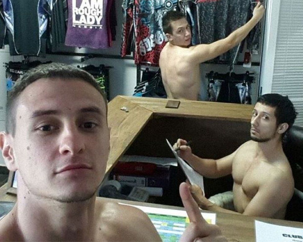 Naked workers in closthes shop