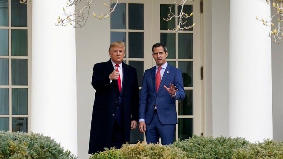 U.S. President Donald Trump gestures to gathered news media with Venezuela's opposition leader Juan Guaido at the White House in Washington on 5 February