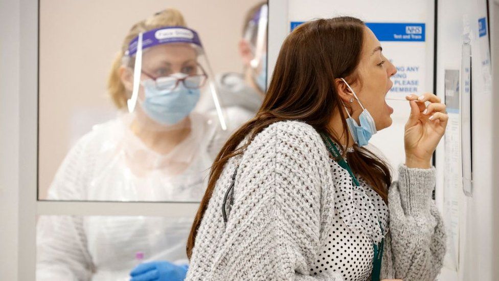 Woman taking Covid swab