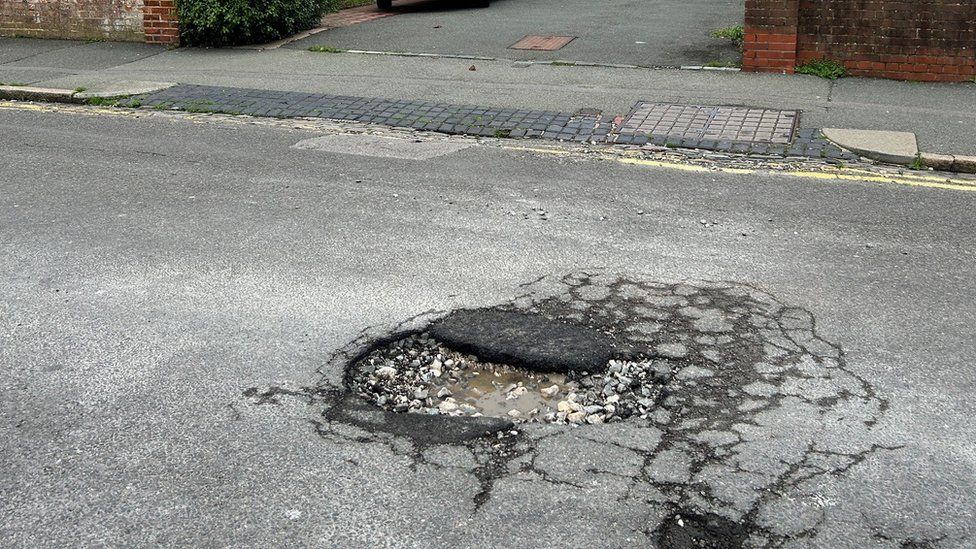 A pothole, partially fixed, in Eastbourne