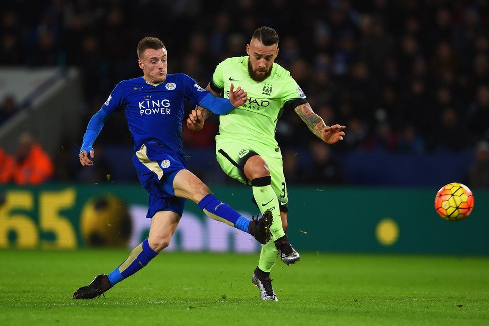Leicester City v Man City - Jamie Vardy is challenged by Nicolas Otamendi