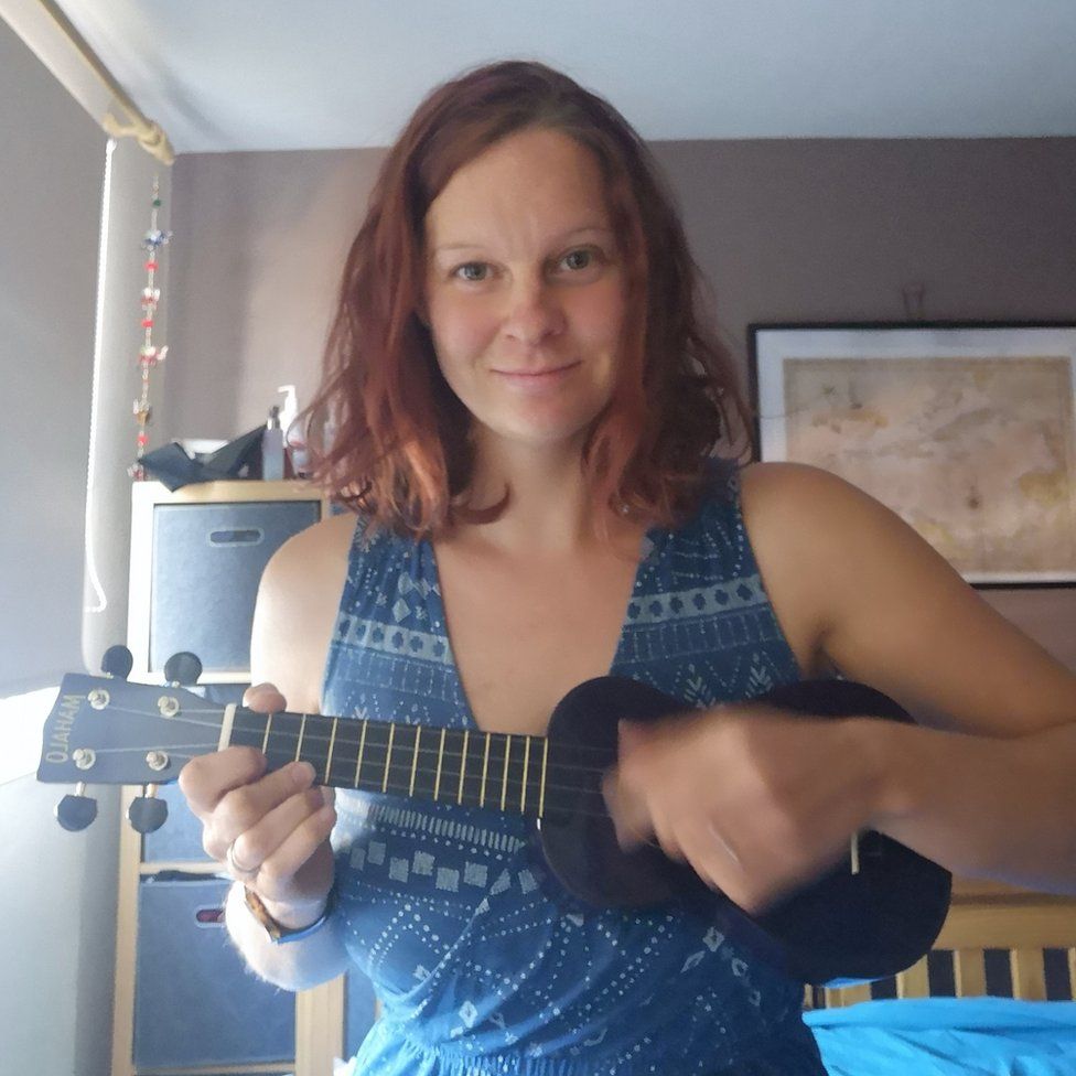 Laura Tarver playing the ukulele.