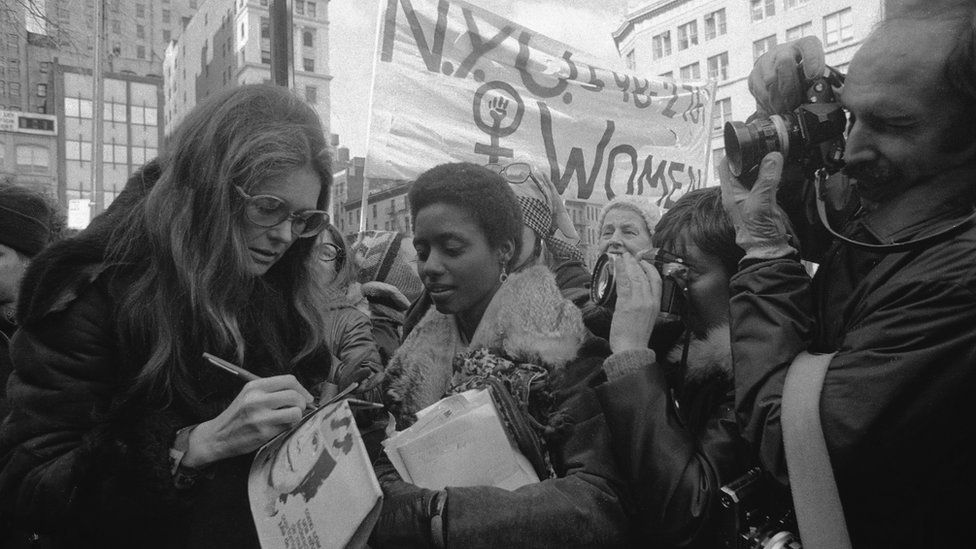 Gloria Steinem with marchers in midtown Manhattan prior to the start of an International Women's Day March