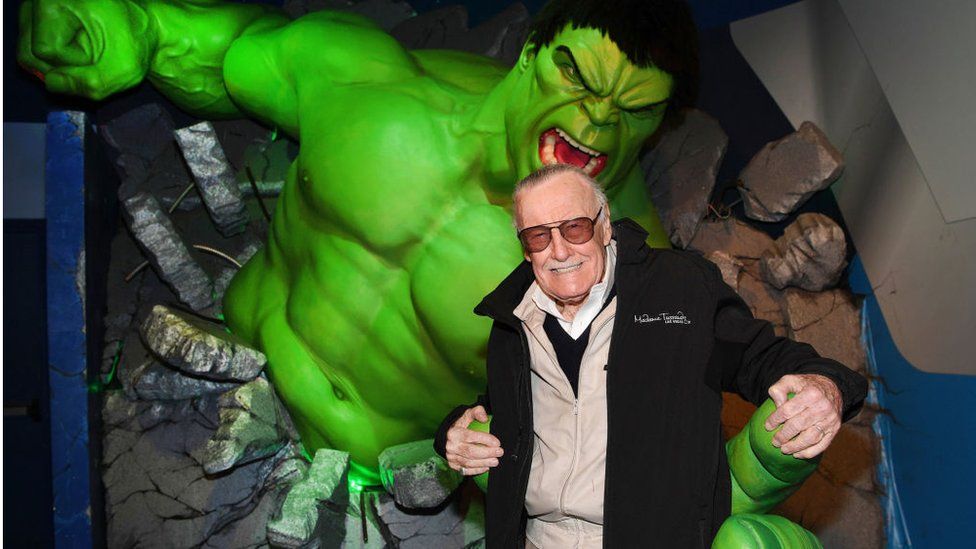 Stan Lee posing with Hulk