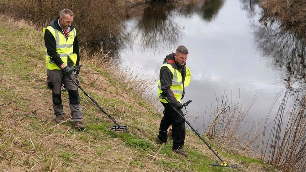 Members of the public use metal detectors on the banks of the River Wyre at St Michael's on Wyre, Lancashire