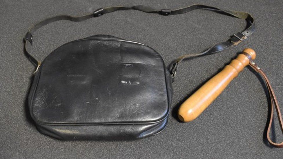 Handbag with truncheon