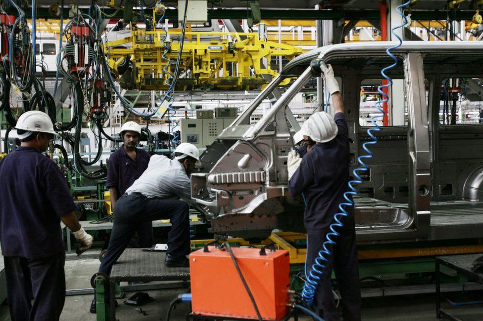 Workers at a Tata Motors assembling plant in Pimpri, India.