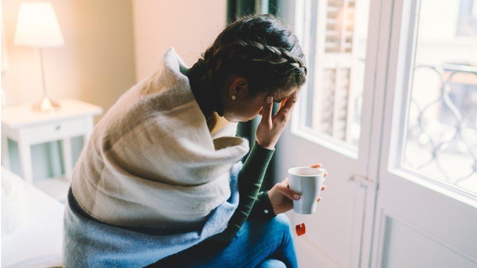 Woman sat in hotel room