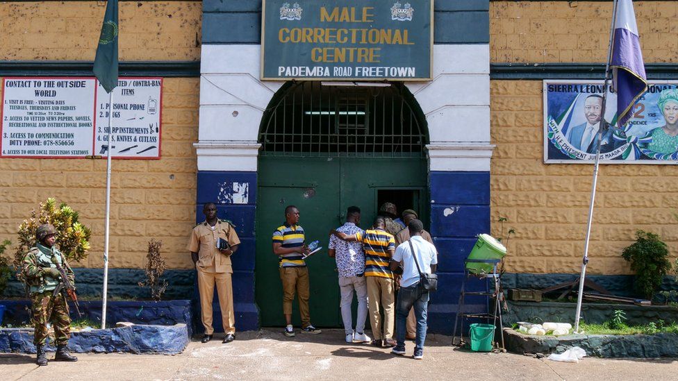Escaped prisoners are brought back to the Male Correction Centre after being caught by police in Freetown, Sierra Leone, 27 November 2023.
