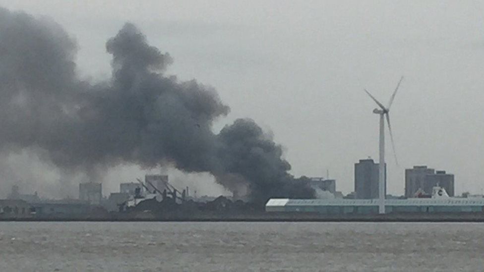 Fire crews tackle scrap metal fire at Alexandra Dock in Bootle - BBC News