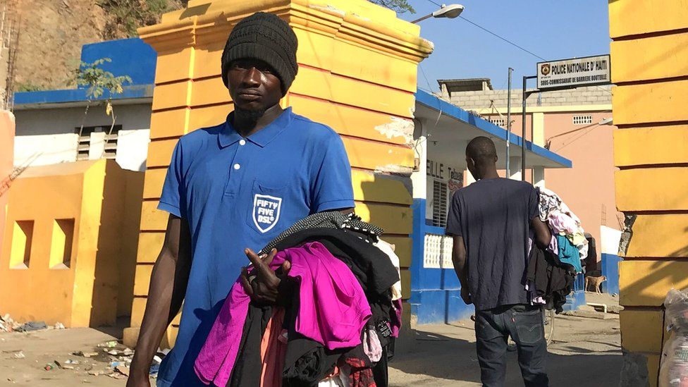 A man sells second-hand clothes on the streets in Haiti
