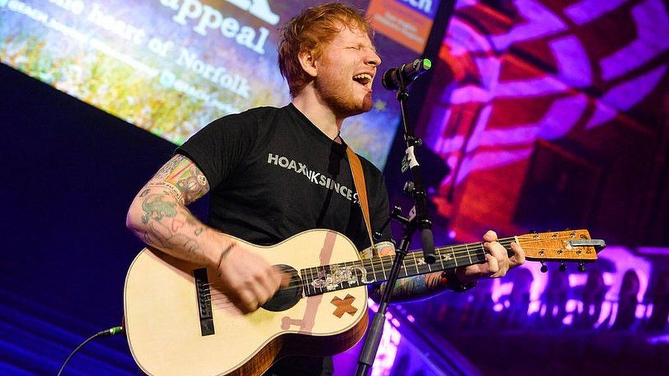 Ed Sheeran performing at a gala