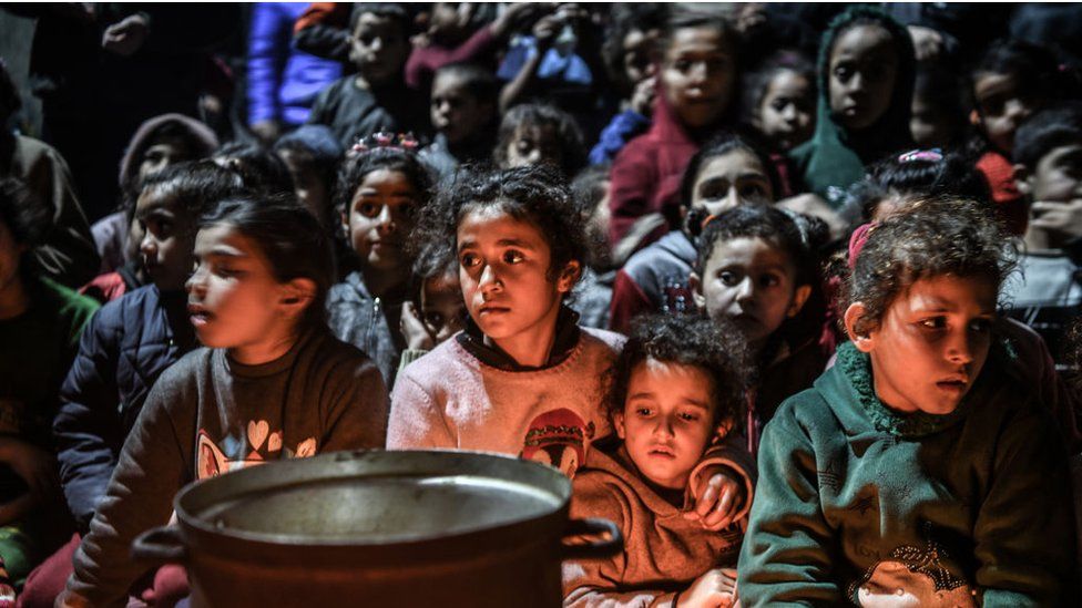 Palestinians, who have to flee their homes to ensure their safety from the Israeli attacks and take refuge in a school, gather to celebrate Lailat al Miraj in Rafah, Gaza on February 8, 2024