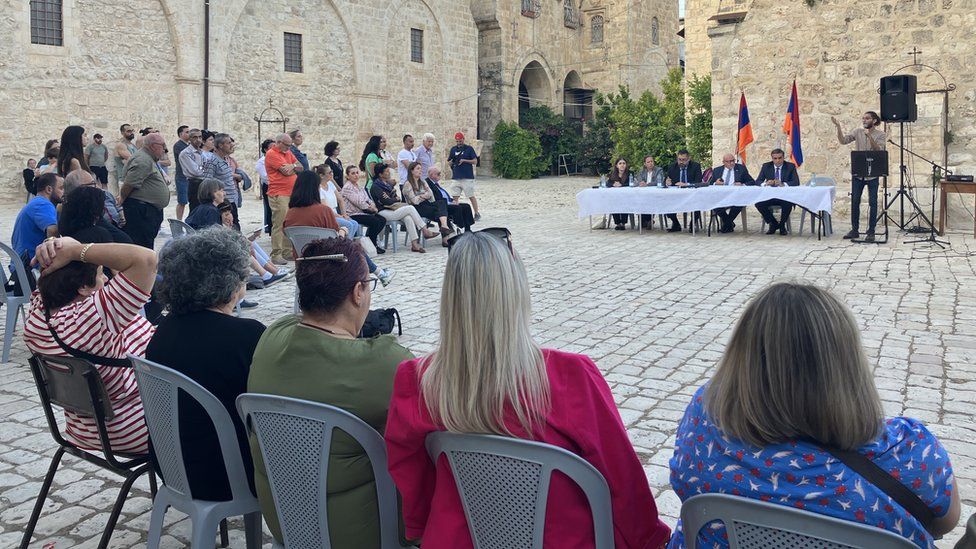 Armenian Jerusalemites listen to a group of international Armenian lawyers who have agreed to draw up recommendations on how to handle the land sale case (16 June 2023)