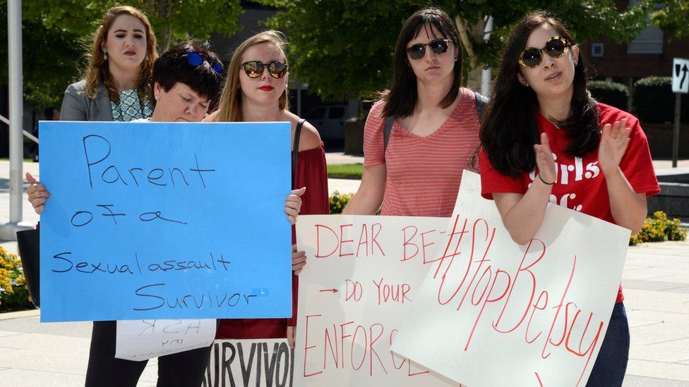 Demonstrators gathered as Education Secretary Betsy DeVos prepared to speak at George Mason University in Arlington, Virginia, on 7 September 2017