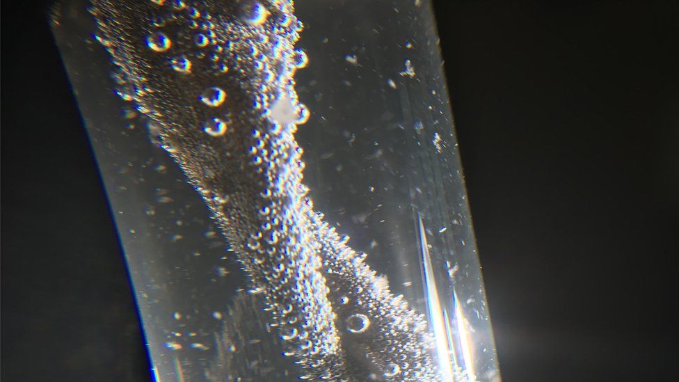Hydrogen forming on from the plastic after light is shone on it