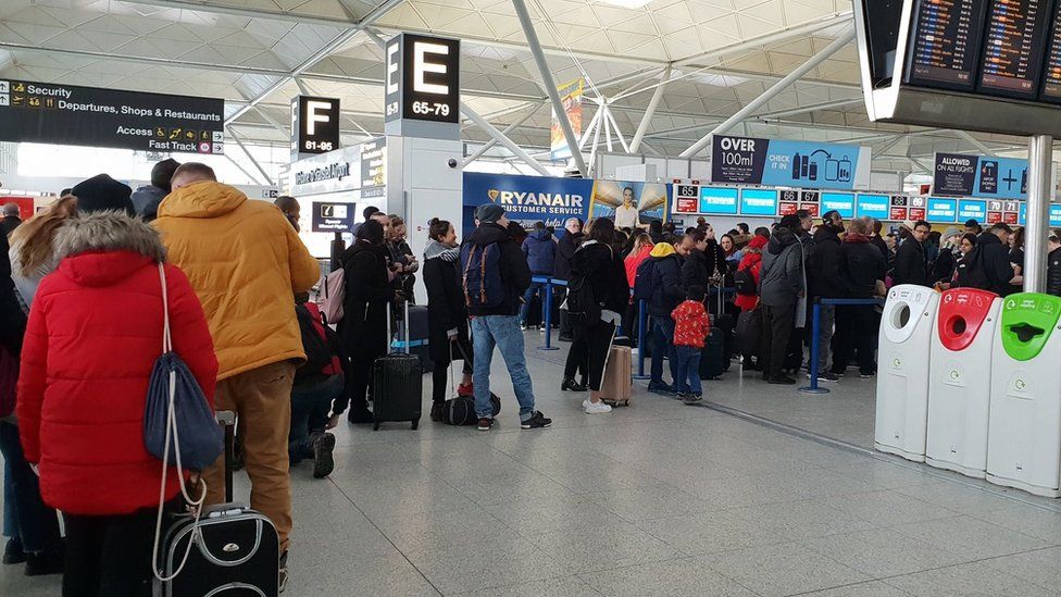 Queues at the Ryanair desk at Stansted Airport, Essex