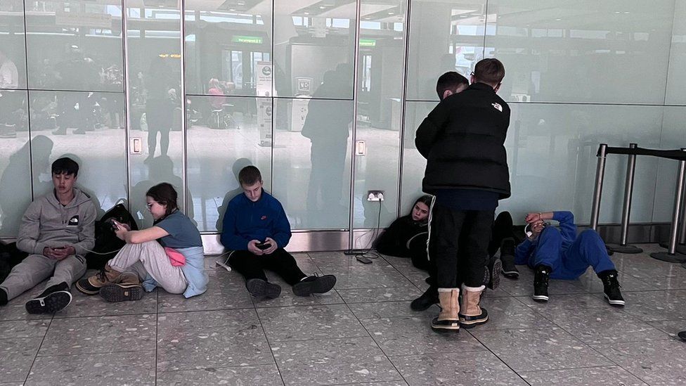 Part of the group from Llantrisant, South Wales, waiting around at Heathrow last week