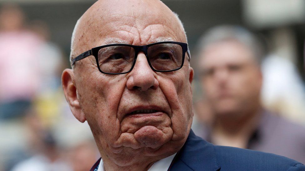 Rupert Murdoch, Chairman of Fox News Channel stands before Rafael Nadal of Spain plays against Kevin Anderson of South Africa.