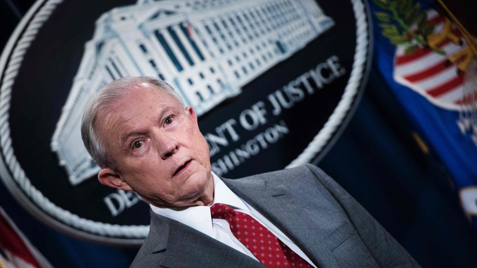 US Attorney General Jeff Sessions waits after speaking at the Department of Justice during an announcement about leaking of classified information on August 4, 2017 in Washington, DC