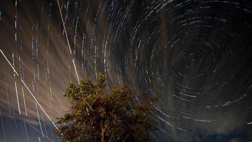 More than 300 stacked digital images of long exposures show Perseid meteors and aircraft crossing the sky near the city of Kumanovo, Republic of North Macedonia on 12 August 2023