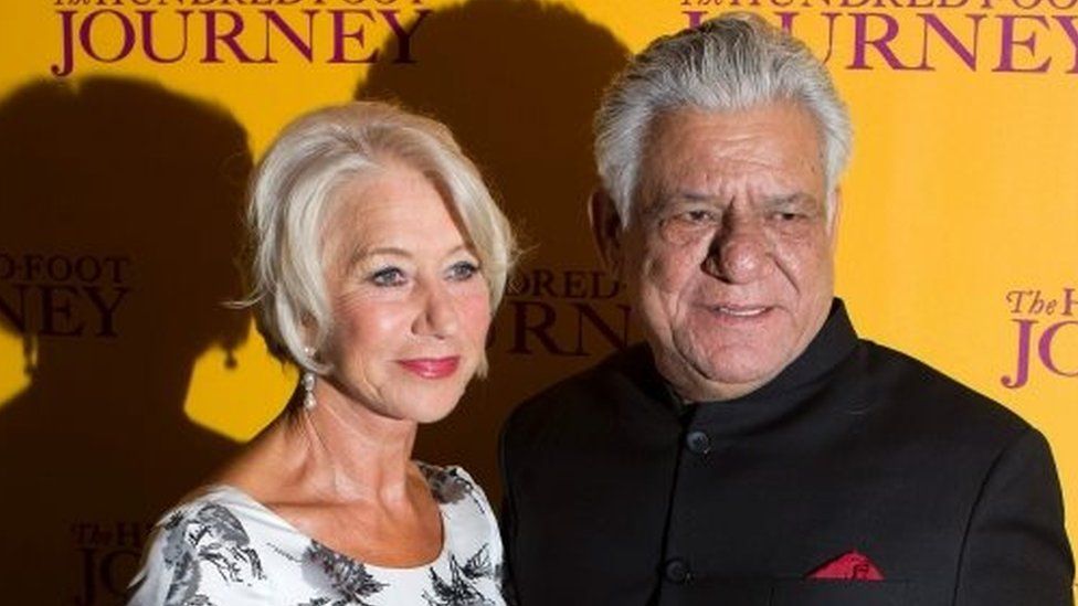 This file photograph taken on September 3, 2014, shows Indian Bollywood actor Om Puri (R) posing with British actress Helen Mirren (L) as they attend the UK Gala Screening of the film, The Hundred Foot Journey,