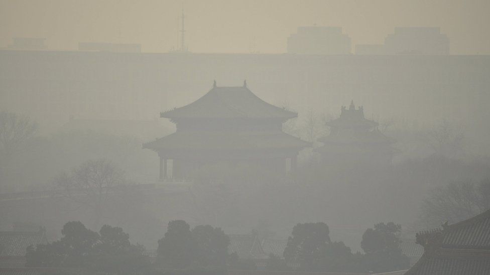 Buildings inside the Forbidden City are seen amid heavy smog under a red alert for air pollution, in Beijing, China, December 19, 2015.