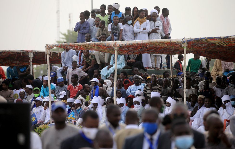 A crowd gathers to witness the state funeral for the late Chadian president Idriss Deby in N"Djamena, Chad, 23 April 2021. Chad"s President Idriss Deby died of injuries suffered in clashes with rebels in the country"s north, an army spokesperson announced on state television on 20 April 2021. Deby had been in power since 1990 and was re-elected for a sixth term in the 11 April 2021 elections. The state funeral will take place on the morning of 23 April 2021, attended by French President Emmanuel Macron.
