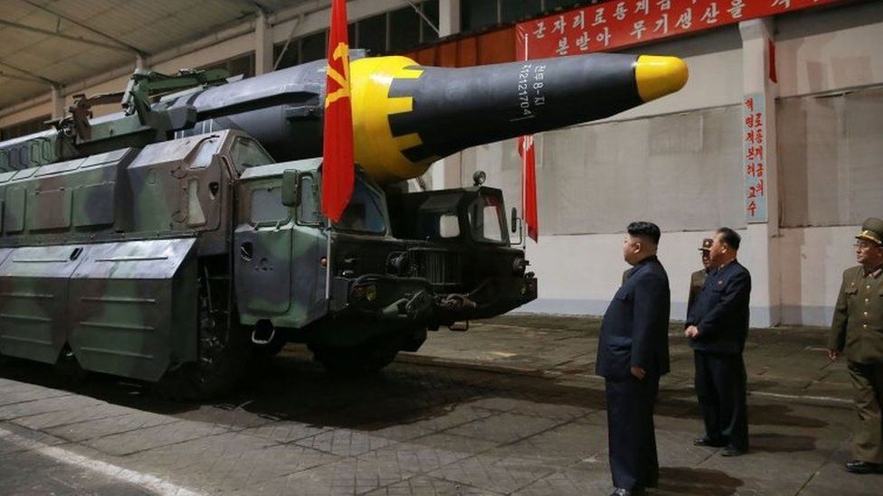 North Korea's Supreme Leader Kim Jong-un (left) inspects a missile in undisclosed location. Photo: 14 May 2017