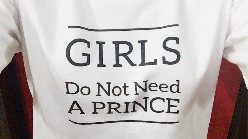 Picture of a T-shirt saying "girls do not need a prince"