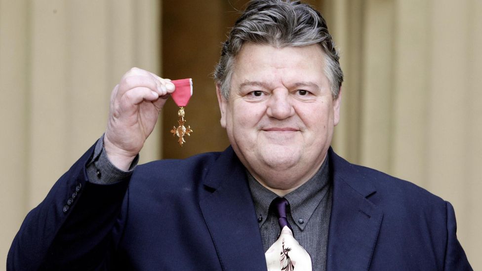 Robbie Coltrane and his OBE in 2006