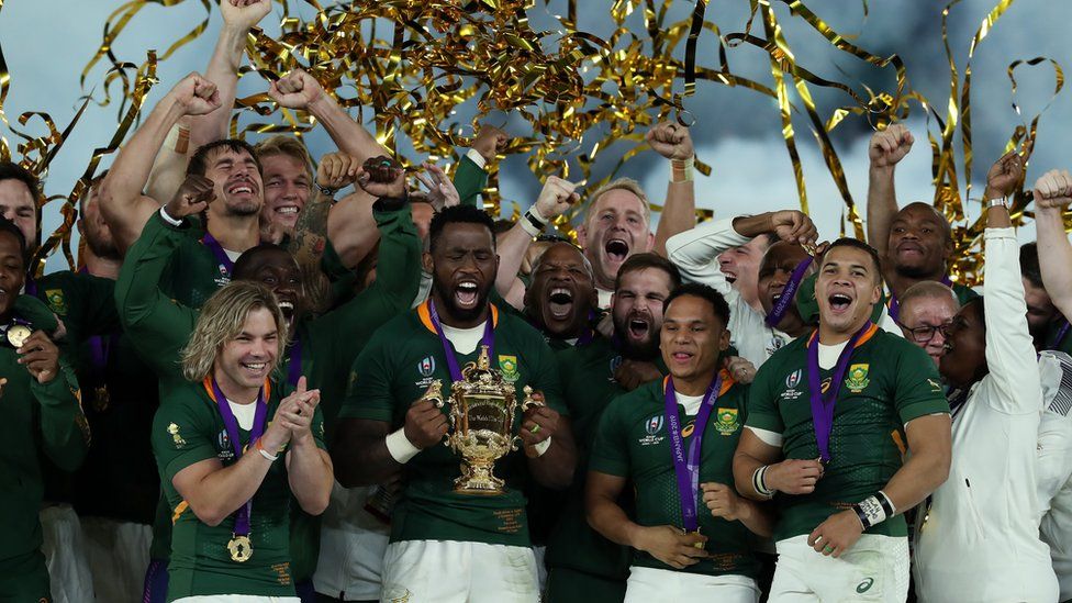 South Africa's Springboks celebrate after being handed the World Cup trophy