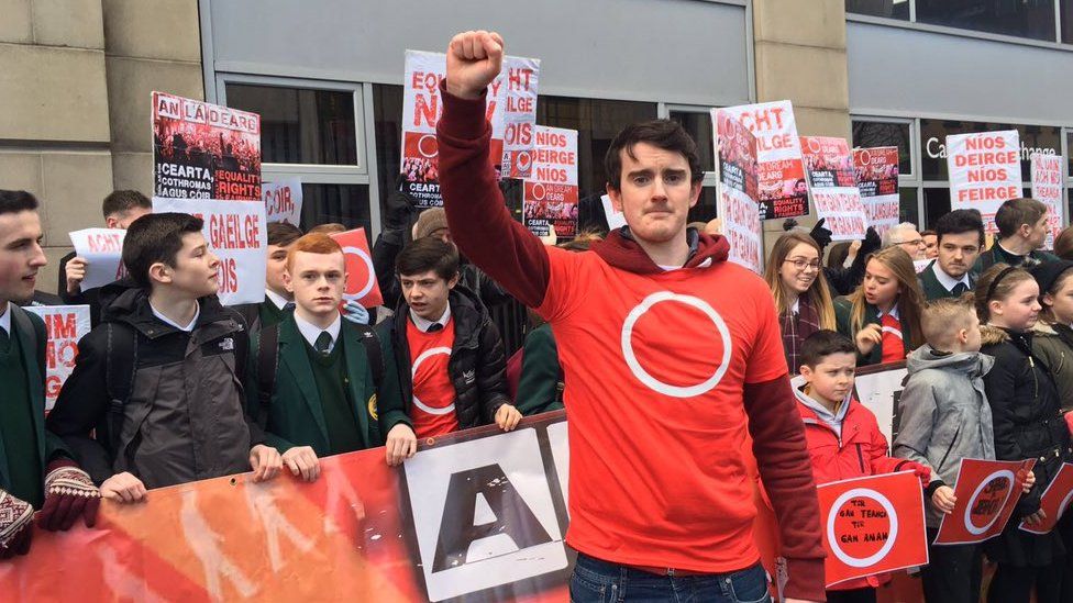 Irish language activists at a protest in Belfast against a decision to cut Irish language bursaries