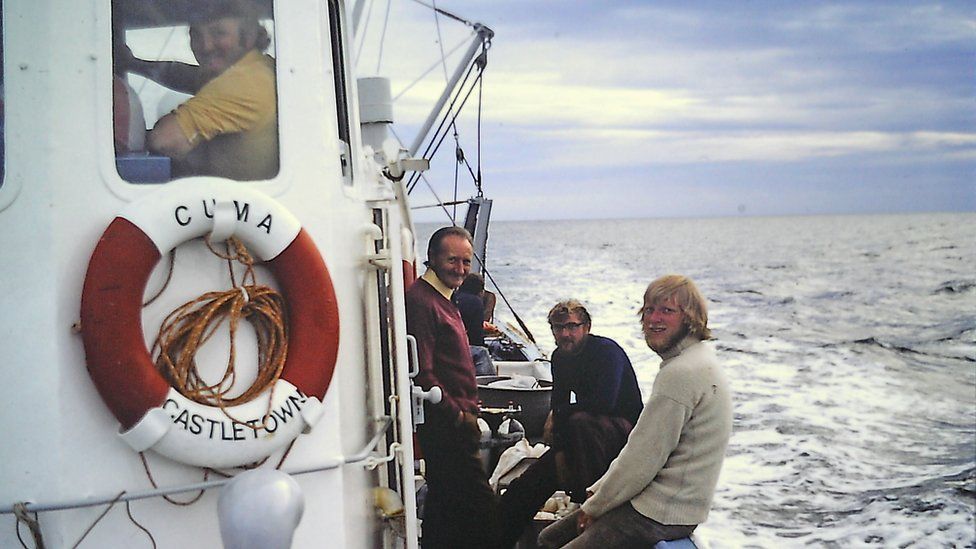 People travelling on a boat in the Irish Sea