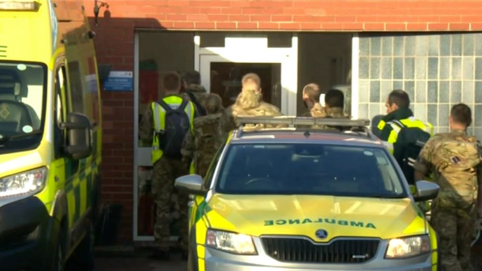 Military personnel at ambulance station