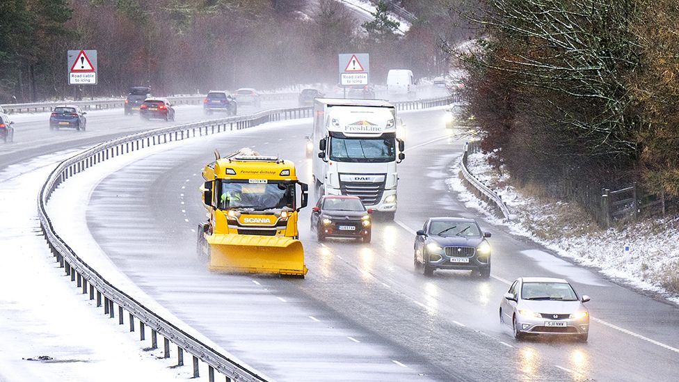 Traffic on the M74 near Abington in South Lanarkshire with snow on the road on December 26, 2022.