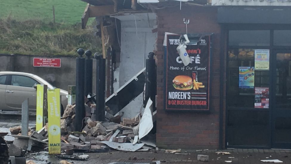 The damaged wall of the filling station