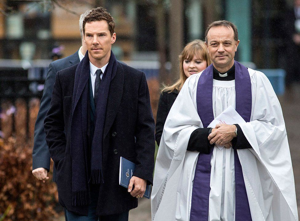 Actor Benedict Cumberbatch (L) and Canon Mike Harrison arrive at Leicester Cathedral for the reinterment ceremony of King Richard III, on March 26, 2015 in Leicester, England.