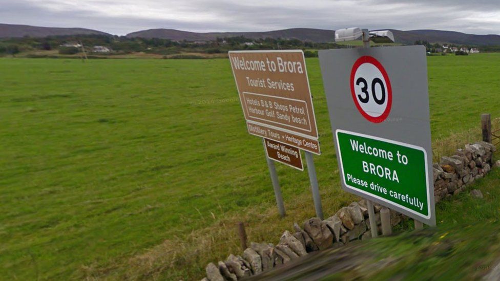 Road signs welcoming motorists to Brora