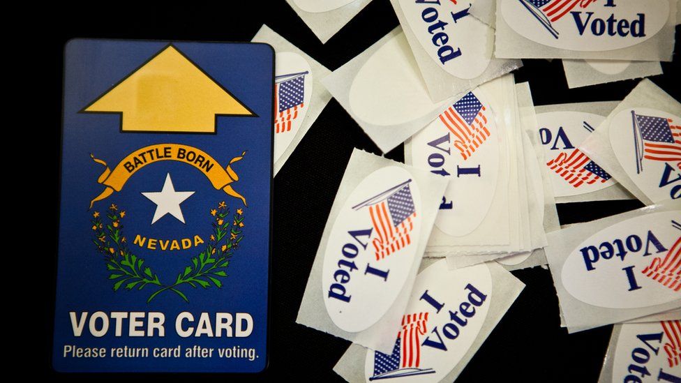 An electronic voting card and vote stickers are seen at a polling place on 6 November 2012 in Sparks, Nevada.