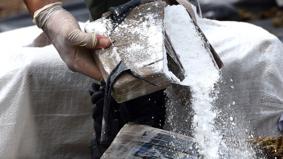 Authorities destroy a bale of cocaine