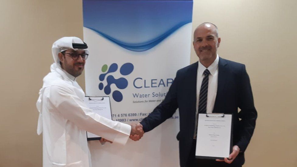 Thani al-Shirawi of the Al Shirawi Group and an executive from the Israeli water company Fluence shaking hands after one of the first memorandums of understandings after the peace deal